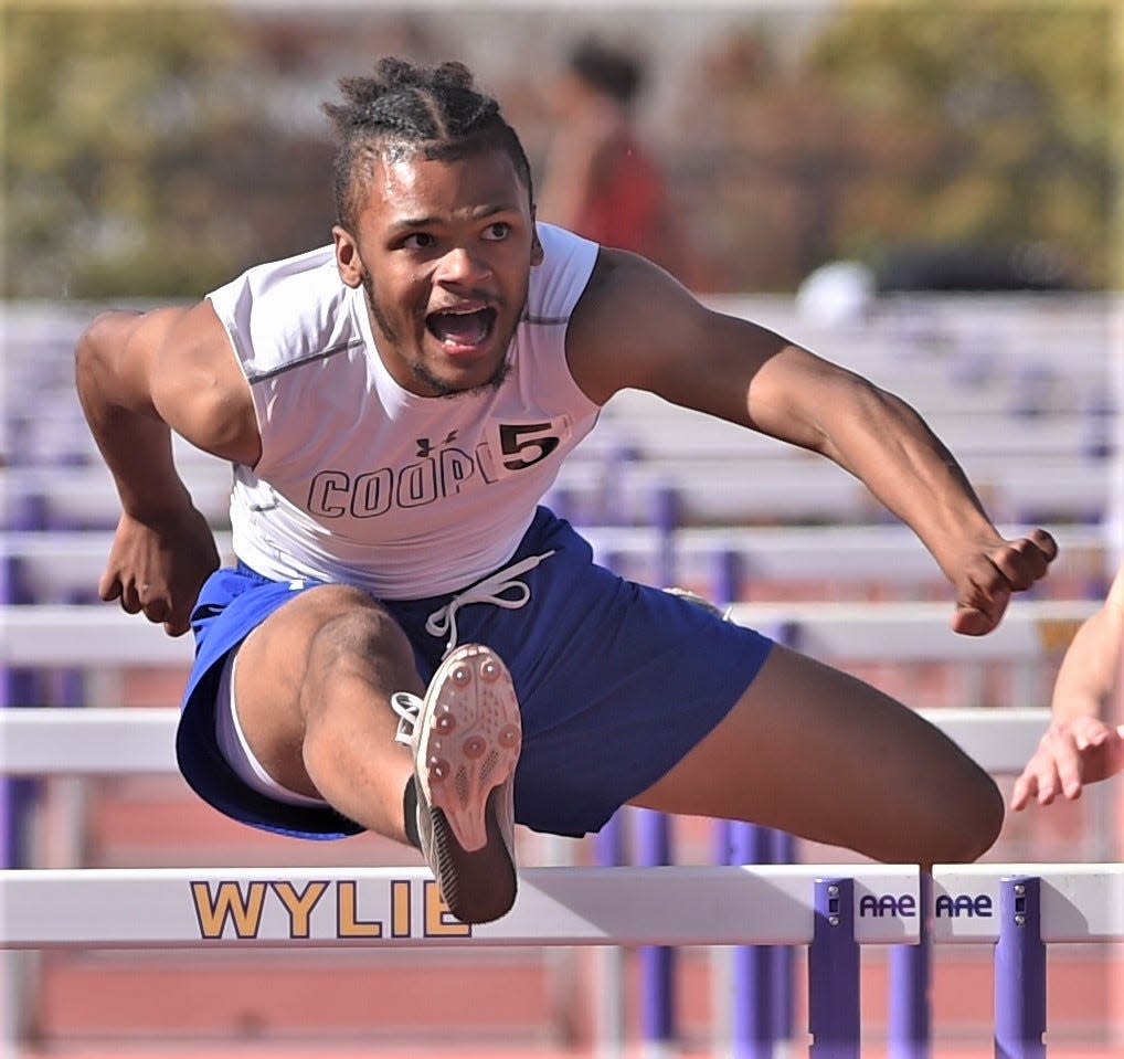 Cooper's Lawrence Diles wins his prelim race in the 110-meter hurdles at the District 4-5A track and field meet April 13 at Sandifer Stadium. He ended up beating Wylie's Holden Atwood in the finals the next day. Both will compete at the Region I-5A meet Friday in Lubbock.