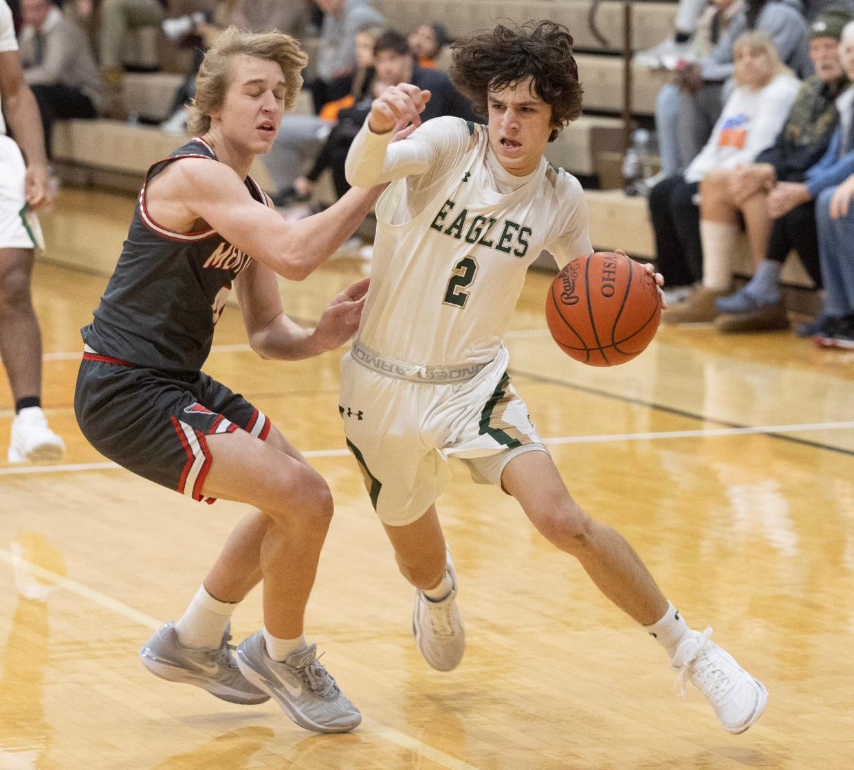 GlenOak guard Bryce Broom drives against Mentor.