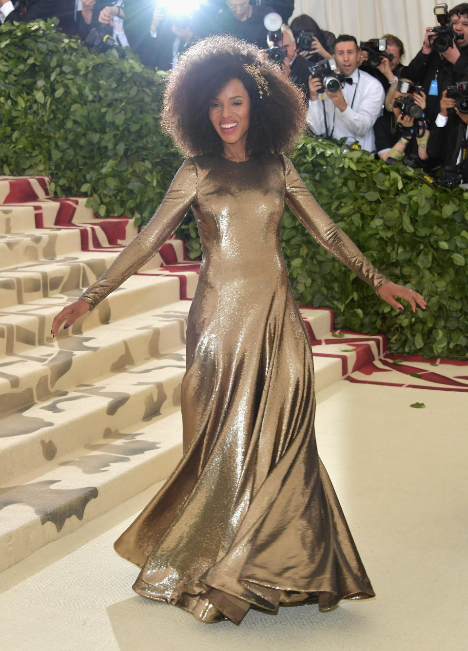 <p>Kerry Washington looked delighted to be at the Met Gala in her gold long-sleeved Ralph Lauren dress. Photo: Getty Images </p>