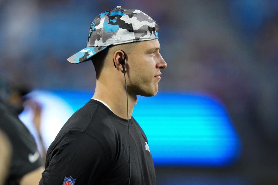 Carolina Panthers running back Christian McCaffrey watches during the first half of an NFL preseason football game against the Buffalo Bills on Friday, Aug. 26, 2022, in Charlotte, N.C. (AP Photo/Jacob Kupferman)