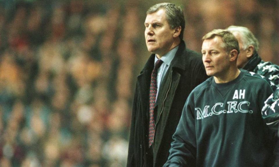 Joe Royle watches a Manchester City defeat by Ipswich in a Division One match in February 1998