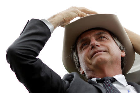 FILE PHOTO: Federal deputy Jair Bolsonaro, a pre-candidate for Brazil's presidential elections takes part a protest against former Brazilian president Luiz Inacio Lula da Silva while the Supreme Court issues its final decision about his habeas corpus plea, in Brasilia, Brazil, April 4, 2018. REUTERS/Ueslei Marcelino/File photo