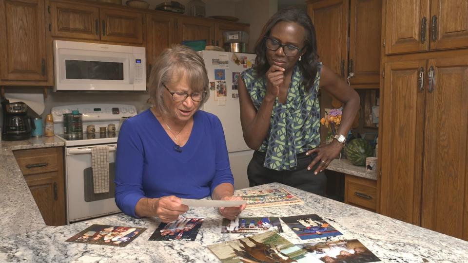 PHOTO: Patty Wetterling looks at old photos alongside ABC News' Deborah Roberts. (ABC News)