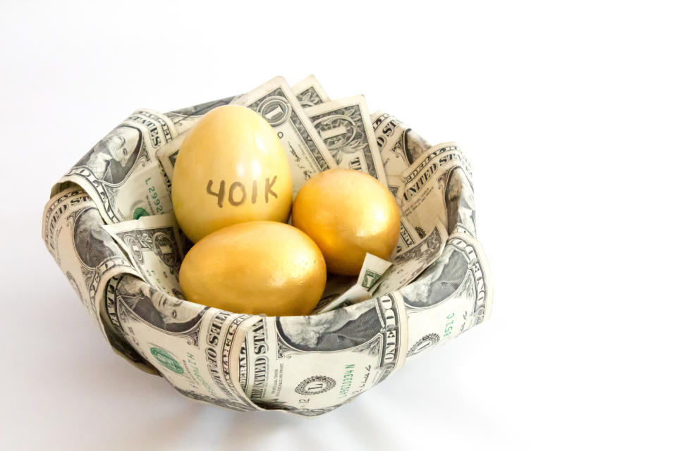 A bowl wrapped in dollar bills with three gold eggs inside, one of which says 401k