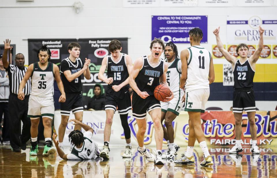 North Oldham's Ian Higdon celebrated after wrestling the ball from Trinity's Andrae Vasser at Friday's Chad Gardner Law King of the Bluegrass Holiday Classic. The Mustangs won 50-48. Dec. 16, 2022 