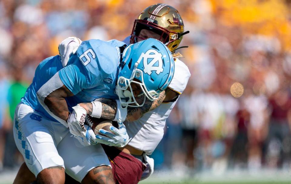 North Carolina’s Nate McCollum (6) scores in a 46-yard pass reception from quarterback Drake Maye in the first quarter against Minnesota on Saturday, September 16, 2023 at Kenan Stadium in Chapel Hill N.C.