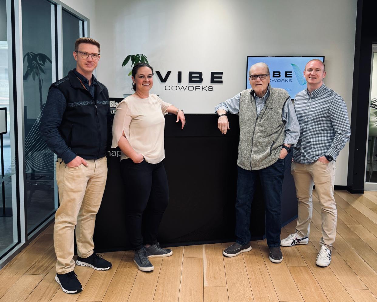 NavalX NW Tech Bridge Director Johannes Schonberg, Vibe Coworks CEO Alanna Imbach, Tech Bridge Deputy Director Ralph Duncan and Violett CEO Branden Doyle (from left to right) were photographed at the front desk of Vibe Coworks in Poulsbo.