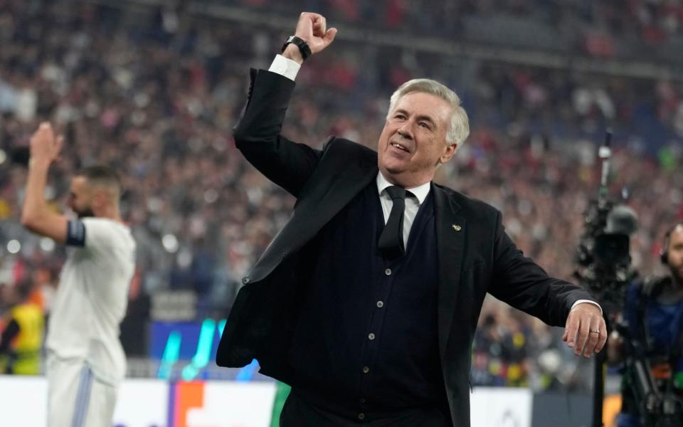 Real Madrid's head coach Carlo Ancelotti celebrates winning the Champions League final soccer match  - AP Photo/Kirsty Wigglesworth