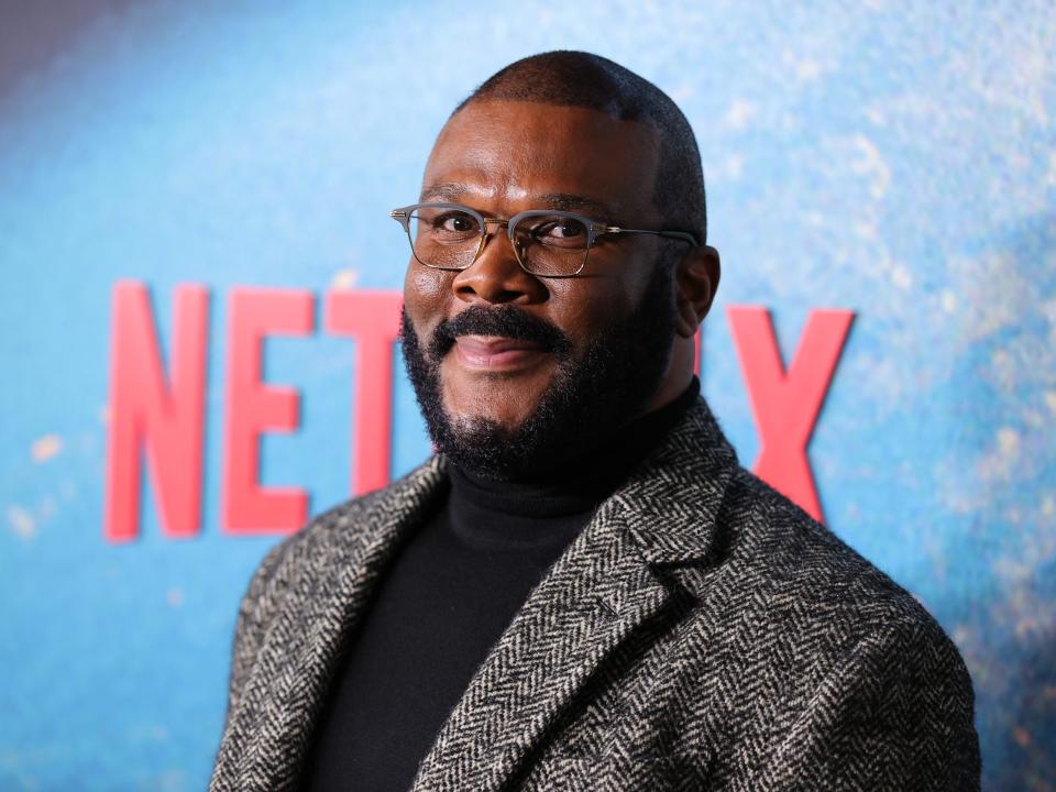 Tyler Perry in a gery jacket and black turtleneck