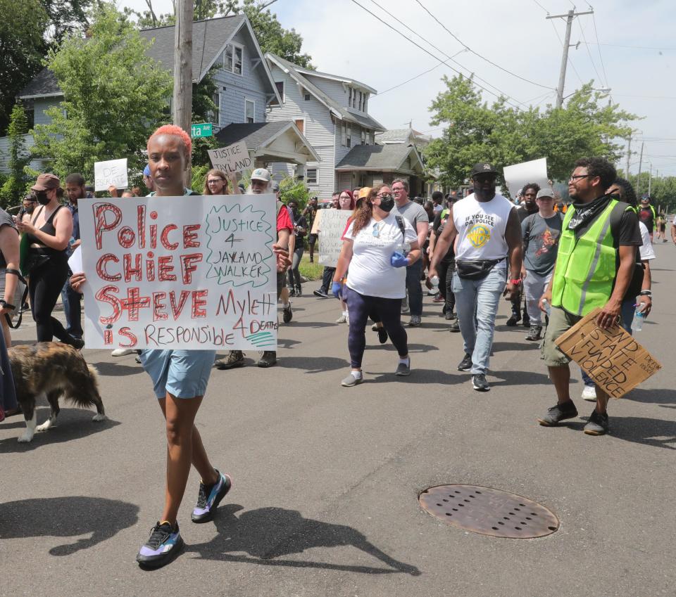 Protesters march Monday on Howard Street in Akron over the police shooting of Jayland Walker.