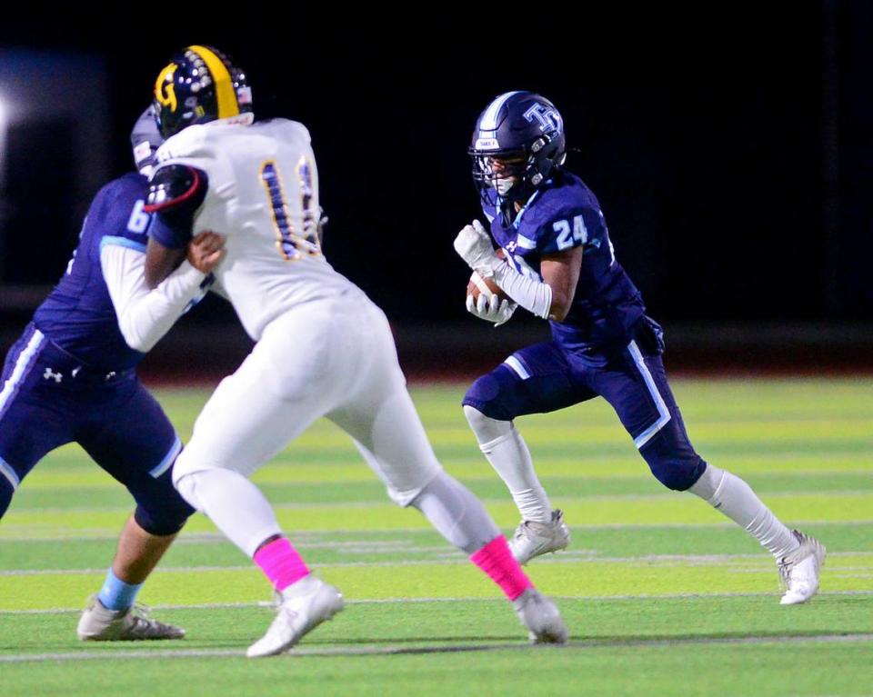 Downey running back Marcus Cruz (24) runs a sweep during a game between Downey and Gregori at Downey High School in Modesto, California on October 27, 2023.