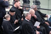 <p>Supreme Court Justices (from L) Ruth Bader Ginsburg, Stephen Breyerm Samuel Alito, John Roberts, Anthony Kennedy, and Clarence Thomas sit on the West Front of the U.S. Capitol on January 20, 2017 in Washington, DC. (Photo: Scott Olson/Getty Images) </p>