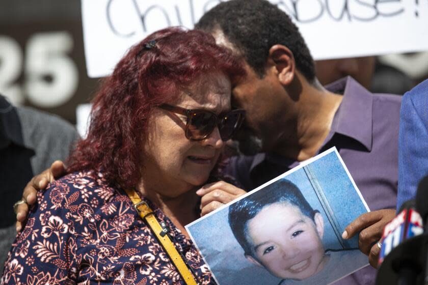 Liz Moughon  Los Angeles Times EVA HERNANDEZ, great-grandmother of Noah Cuatro, a 4-year-old boy who died on July 6, is comforted by activist Najee Ali at a news conference Tuesday.