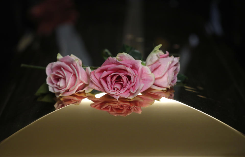 Flowers adorn the casket of Aretha Franklin as it is laid to rest at Woodlawn Cemetery in Detroit, Friday, Aug. 31, 2018. Franklin died Aug. 16, 2018 of pancreatic cancer at the age of 76. (AP Photo/Paul Sancya, Pool)