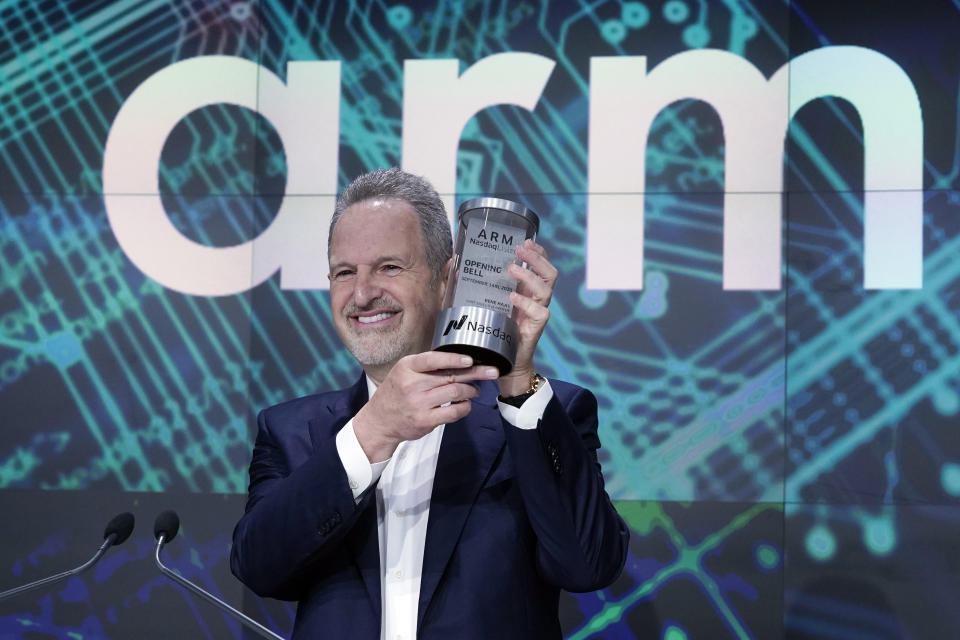 ARM Holdings CEO Rene Haas, holds the Nasdaq Opening Bell Crystal at the Nasdaq MarketSite, during his company's IPO, in New York's Times Square, Thursday, Sept. 14, 2023. (AP Photo/Richard Drew)