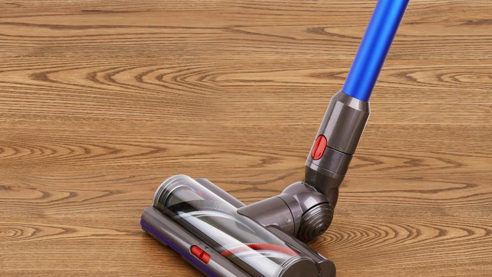 motorized head of modern vacuum cleaner on a wooden floor