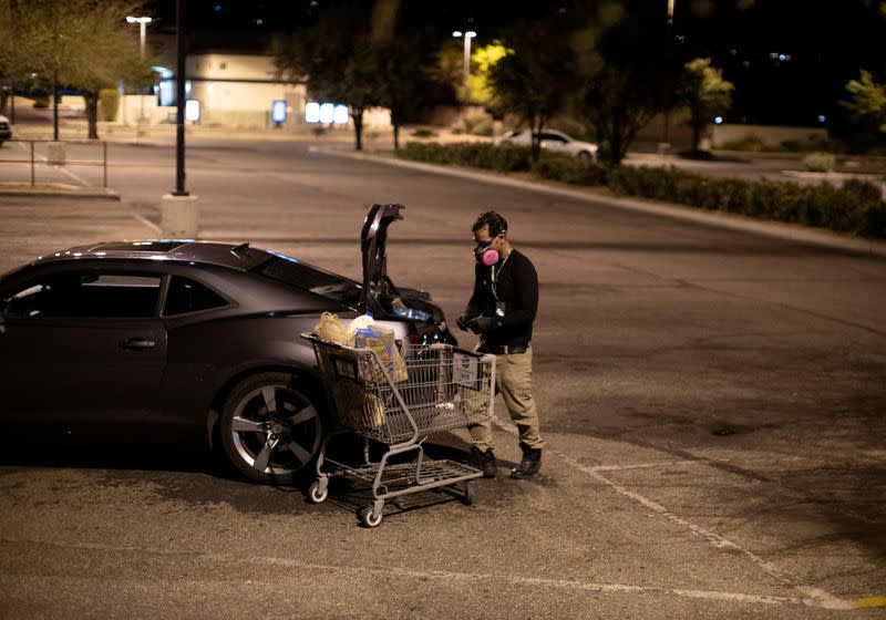 FILE PHOTO: Instacart employee Eric Cohn works amid the coronavirus outbreak