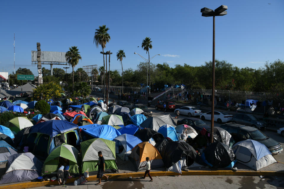 Migrants, most of them asylum-seekers sent back to Mexico from the U.S. under the Trump administration's "Remain in Mexico" program, occupy a makeshift encampment in Matamoros, Mexico, on Oct. 28, 2019. (Photo: Loren Elliott / Reuters)