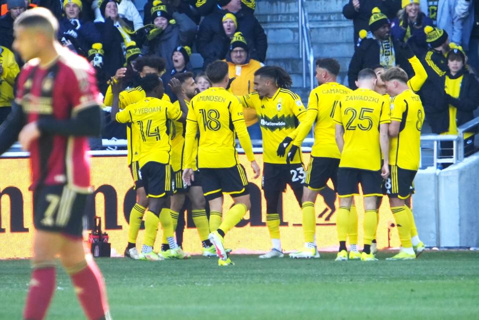 Crew players celebrate a goal by forward Cucho Hernandez (9) during Saturday's 1-0 win over Atlanta United.