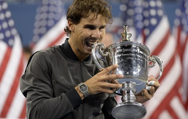 Rafael Nadal of Spain celebrates with the trophy following victory over Novak Djokovic of Serbia in their 2013 US Open men's singles final match at the USTA Billie Jean King National Tennis Center in New York on September 9, 2013. Nadal won 6-2, 3-6, 6-4, 6-1