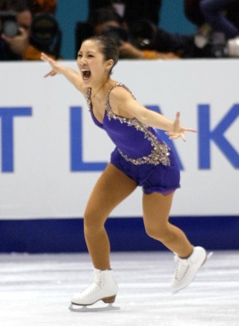 Michelle Kwan, of the U.S., is all smiles after hitting her jumps during her short program on Tuesday, Feb. 19, 2002 at the Salt Lake Ice Center. | Chuck Wing, Deseret News