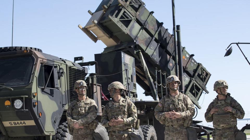 U.S. soldiers with the 10th Army Air and Missile Defense Command stand next to a Patriot surface-to-air missile battery during the NATO exercise Tobruq Legacy 2017 at Siauliai airbase in Lithuania on July 20, 2017. (Mindaugas Kulbis/AP)