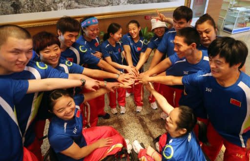 Chinese athletes gathering for a meeting prior to departing for the London Paralympics 2012, in Beijing, August 2012. In Beijing in 2008, 332 Chinese athletes took part -- the largest ever Chinese Paralympic delegation, but only 282 will take part in London, and almost half are debutants at the event