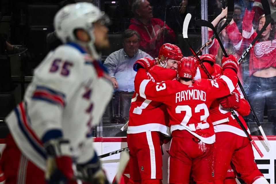 Rangers defenseman Ryan Lindgren looks on as the Red Wings celebrate J.T. Compher's goal during the second period on Friday, April 5, 2024, at Little Caesars Arena.