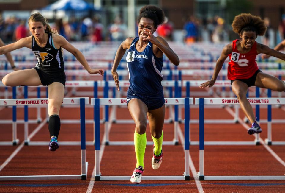 Delcastle's Sherita Lowman sprints to the finish line after clearing the final hurdle to win the girls 100-meter hurdles at the Meet of Champions at Dover High School in 2016.
