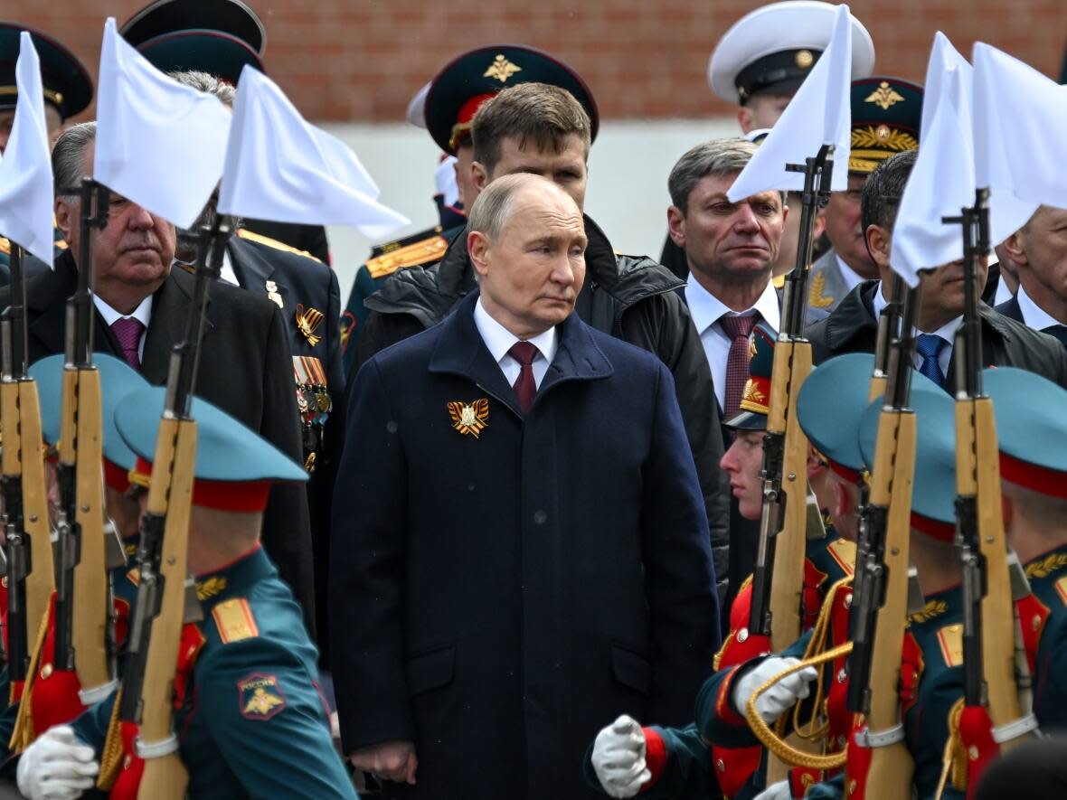 Russian President Vladimir Putin, center, attends a wreath-laying ceremony at the Tomb of the Unknown Soldier after the Victory Day military parade in Moscow on Thursday, May 9, 2024. (Kremlin Pool Photo via AP - image credit)