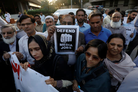 Journalists chant slogans during a rally protest which they say is against layoffs and the non-payment of salaries, in Karachi, Pakistan February 26, 2019. Picture taken February 26, 2019. REUTERS/Akhtar Soomro