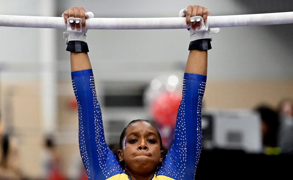 Fisk University gymnast Morgan Price competes in the uneven bars during the Tennessee Collegiate Classic meet Friday, Jan. 20, 2023, in Lebanon, Tenn. Fisk is the first historically Black university to have an intercollegiate women’s gymnastics team.