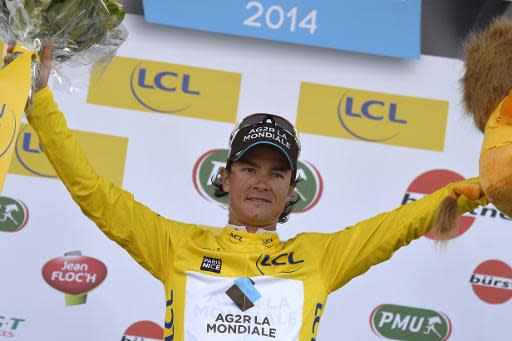 El ciclista colombiano Carlos Betancur Gómez celebra su victoria en la París-Niza, el 16 de marzo de 2014 en Niza (sureste de Francia) (AFP | Eric Feferberg)