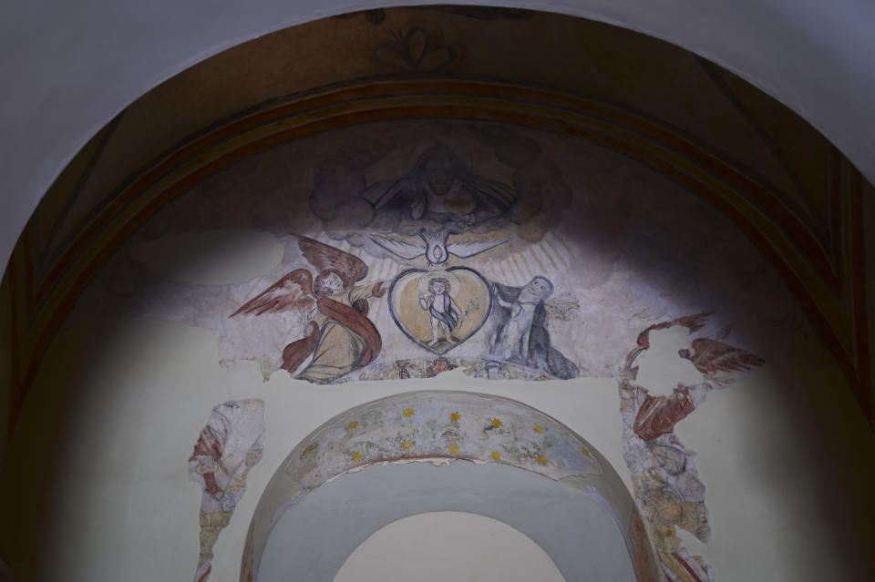 Details of a centuries-old mural are preserved inside San Jose Church, the second oldest Spanish church in the Americas, which will reopen following a massive reconstruction that took nearly two decades to complete, in San Juan, Puerto Rico, Tuesday, March 9, 2021. As workers probed with radar and laser technology and physically peeled away the church’s layers, they uncovered centuries-old murals and architectural techniques once used by the Romans. (AP Photo/Carlos Giusti)