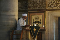 An imam reads a sermon before prayers at a mosque in Istanbul, Wednesday, Aug. 15, 2018. The Turkish lira has nosedived in value in the past week over concerns about Turkey's President Recep Tayyip Erdogan's economic policies and after the United States slapped sanctions on Turkey angered by the continued detention of an American pastor. (AP Photo/Lefteris Pitarakis)