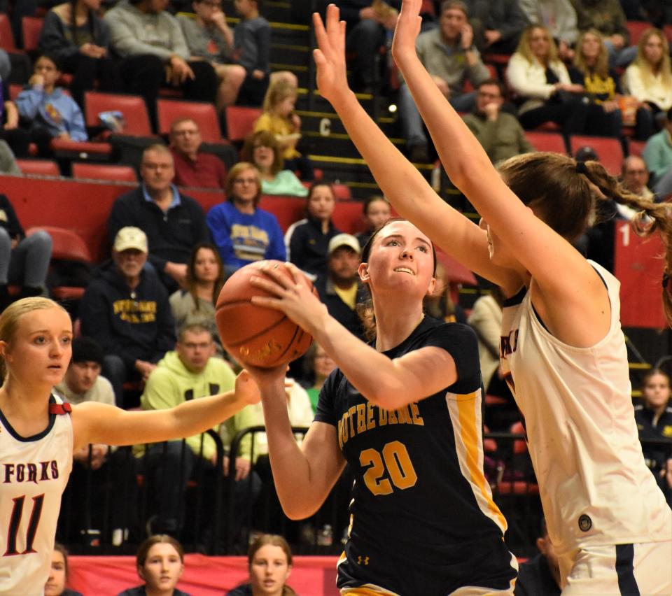 Ella Trinkaus (20) prepares to shoot for Notre Dame in regional play March 10 with Jessica Stone defending for Chenango Forks at Visions Veterans Memorial Arena in Binghamton. Notre Dame's Jugglers continue their season in the state's Class B Final Four this weekend at Hudson Valley Community College.