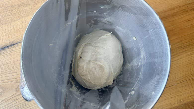 Dough rising in covered bowl