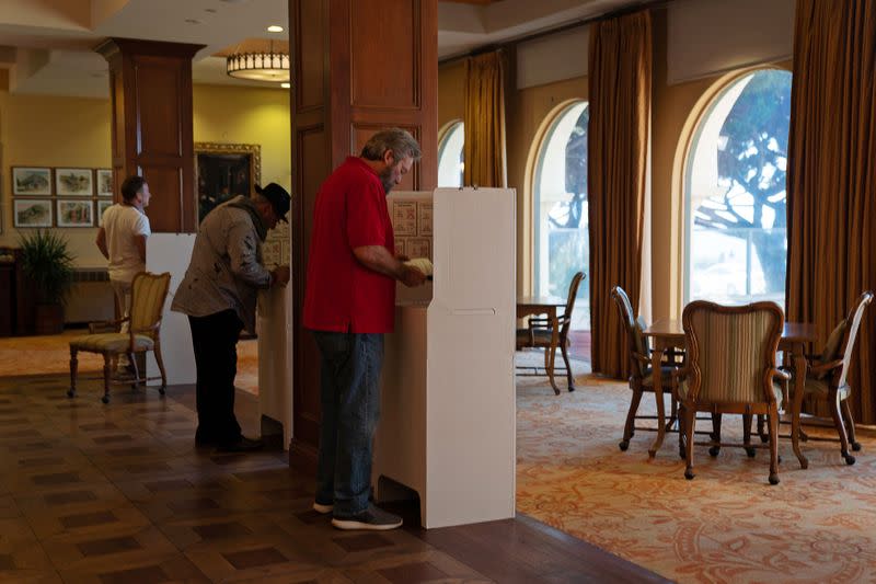 Voters fill out their ballots for the California Democratic presidential candidate primary at the Casa de Manana Retirement Community in La Jolla