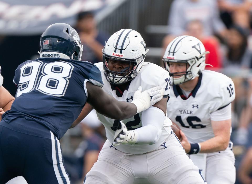 Oct 16, 2021; East Hartford, Connecticut, USA; Yale Bulldogs offensive lineman Kiran Amegadjie (72) blocks Connecticut Huskies defensive lineman Lwal Uguak (98) during the first half at Rentschler Field at Pratt & Whitney Stadium. Mandatory Credit: Gregory Fisher-USA TODAY Sports