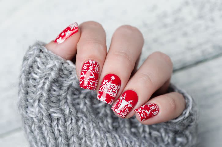 red christmas manicure with deer and snowflakes and norwegian pattern