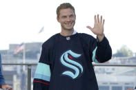 Jamie Oleksiak, a defenseman from the Dallas Stars, is introduced as a new player with the Seattle Kraken NHL hockey team, Wednesday, July 21, 2021, during the Kraken's NHL expansion draft event in Seattle. (AP Photo/Ted S. Warren)