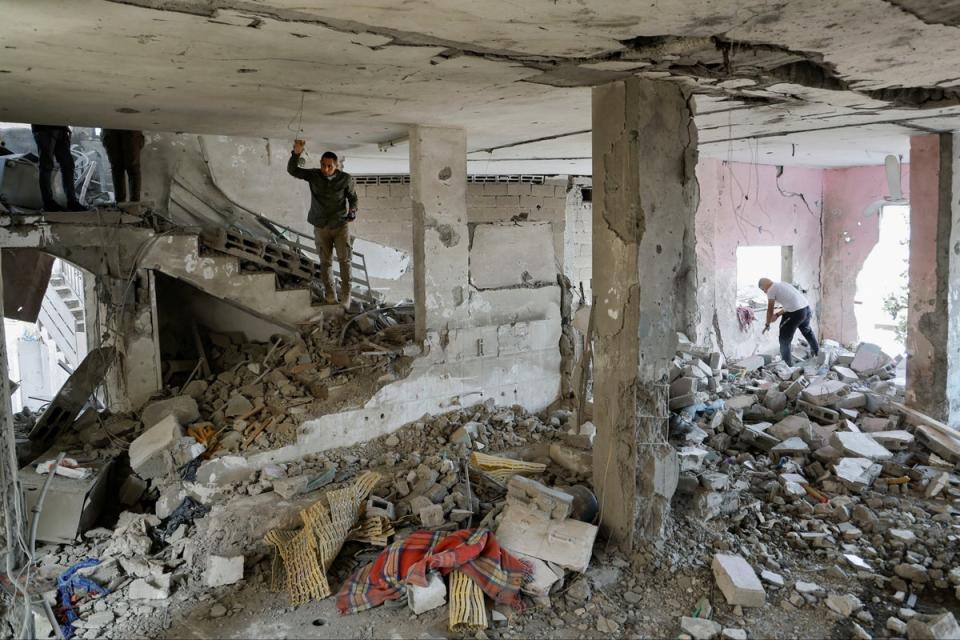 Palestinians check the damage inside a mosque which was hit in an Israeli air strike, in Jenin refugee camp in the Israeli-occupied West Bank (Reuters)