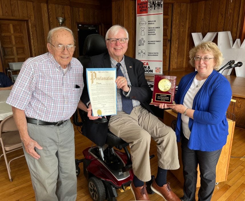 Alliance Mayor Alan Andreani, center, read a mayoral proclamation in honor of Joe Zelasko, left, declaring June 29, 2023, as Joe Zelasko Day. The retired teacher who recently turned 90 is stepping down from the Alliance Historical Society's board of trustees after 52 years of service. At right is Alliance Historical Society President Karen Perone.