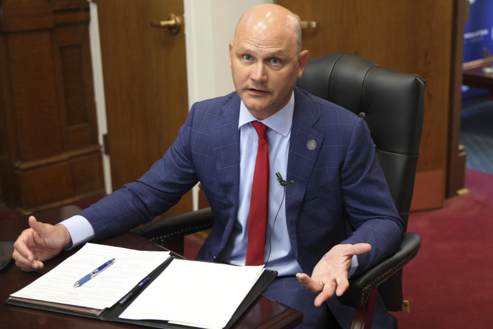 FILE - Kansas Secretary of State Scott Schwab answers questions during an interview in his office in Topeka, Ka., July 20, 2022. Schwab is a conservative former Kansas House member who has defended the use of ballot drop boxes that former President Donald Trump and other Republicans say are prone to misuse, even though there is no widespread evidence of that. (AP Photo/John Hanna, File)