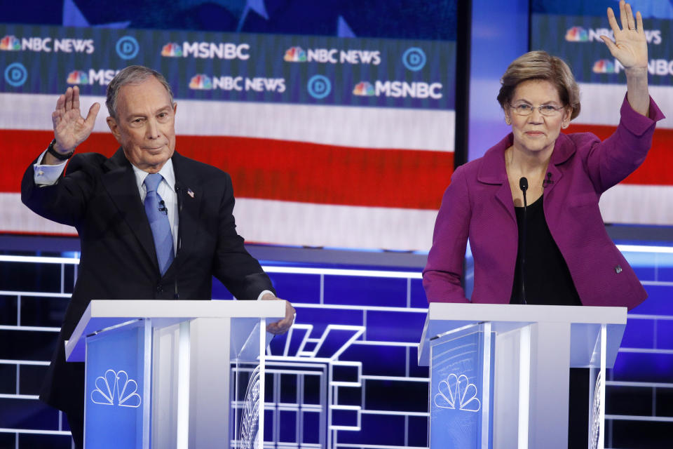 Democratic presidential candidates, former New York City Mayor Mike Bloomberg, left, and Sen. Elizabeth Warren, D-Mass., try to answer a question during a Democratic presidential primary debate Wednesday, Feb. 19, 2020, in Las Vegas, hosted by NBC News and MSNBC. (AP Photo/John Locher)