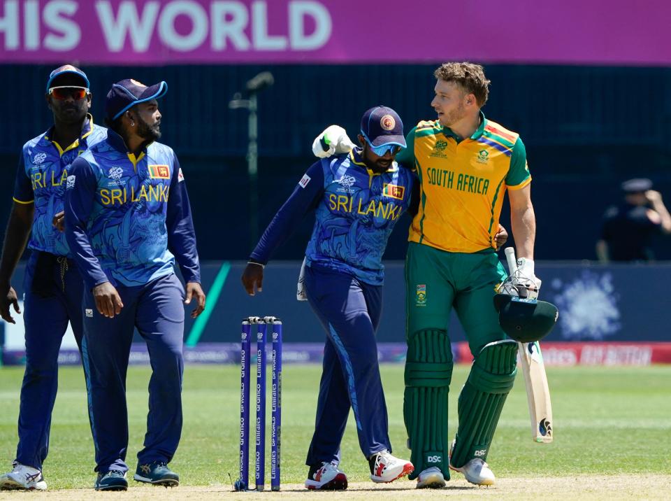South Africa's David Miller (R) greets members of the Sri Lankan team during the ICC men's Twenty20 World Cup 2024 match where South Africa defeated Sri Lanka at Nassau County International Cricket Stadium in East Meadow, New York on June 3, 2024.