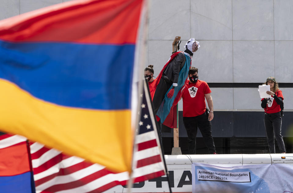 Protestors show a mannequin with the face of Turkish President Recep Tayyip Erdogan hanging on a wooden gallow set on top of a rental moving truck, as they hold a rally protesting against the Armenian genocide in Beverly Hills, Calif., Saturday, April 24, 2021. The systematic killing and deportation of more than a million Armenians by Ottoman Empire forces in the early 20th century was "genocide," the United States formally declared on Saturday, as President Joe Biden used that precise word after the White House had avoided it for decades for fear of alienating ally Turkey. (AP Photo/Damian Dovarganes)