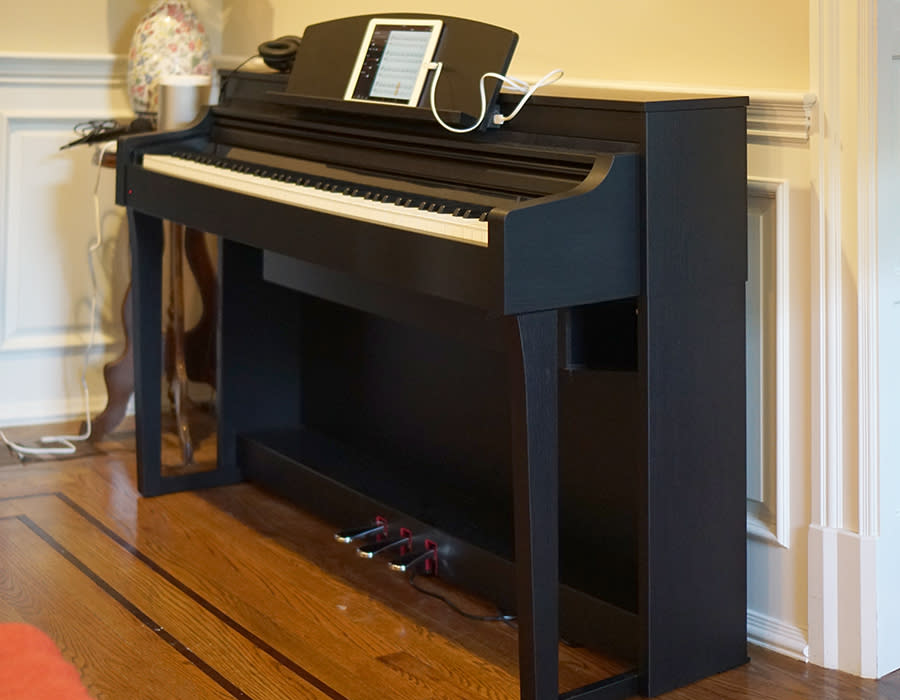 The Yamaha Clavinova CSP looks and sounds like a nice upright piano.