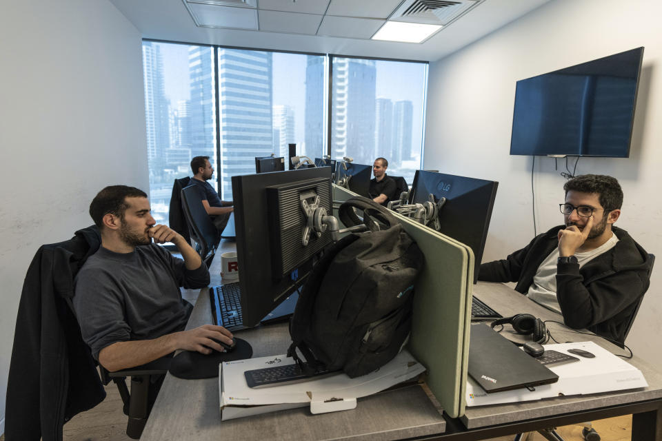 Employees of Pyramid Analytics hi-tech company work at their office in Ramat Gan, Israel, Wednesday, Jan. 18, 2023. As Israel's new government pushes ahead with its far-right agenda, the tech industry is speaking out in unprecedented criticism against policies it fears will drive away investors and decimate the booming sector, Israel. (AP Photo/Tsafrir Abayov)