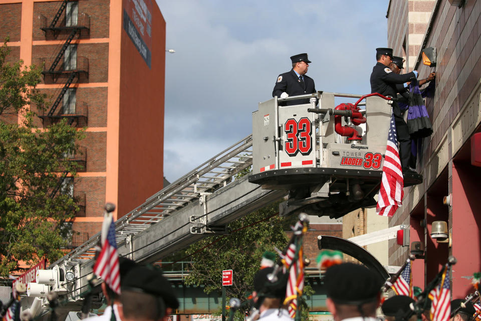 <p>FDNY members drape purple and black bunting on the exterior of the firehouse where Battalion Chief Michael J. Fahy, who died in a building explosion on Tuesday, served- Battalion 19, Engine Company 75 and Ladder Company 33, in the Bronx borough of New York on Sept. 28, 2016. (REUTERS/Shannon Stapleton) </p>